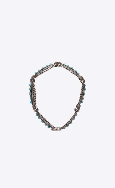 Western-style bracelet with mini cabochons in metal and turquoise.